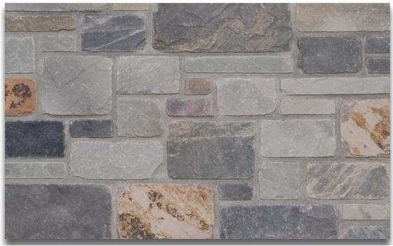 Multi-color natural stone veneer wall cladding with mixed rectangular and square stones