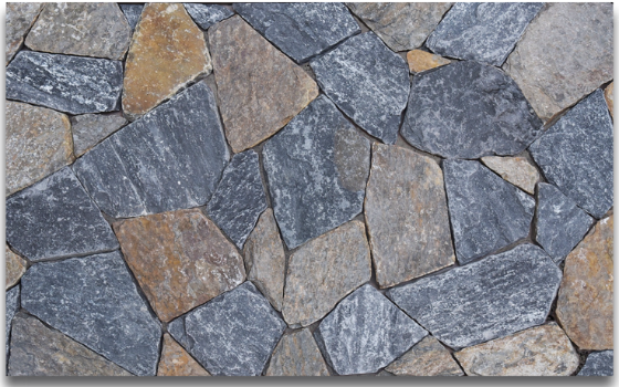 Mosaic natural stone veneer wall cladding with irregular-shaped gray and brown stones