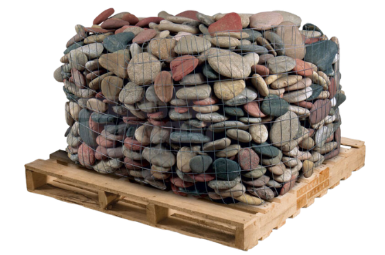 Multi-color natural river rock stones in a wire basket on a wooden pallet