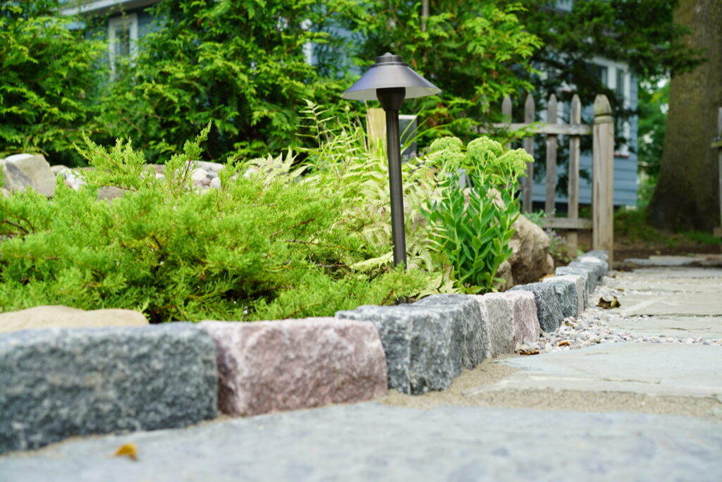 Natural stone landscaping installation project in a backyard setting