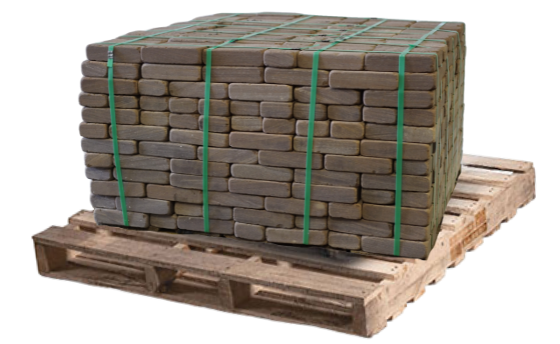 New brownstone tumbled natural stone pavers bundled on a wooden pallet for patios and walkways