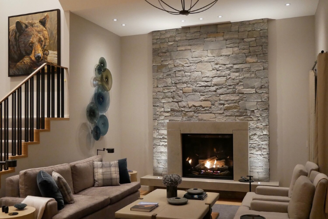 Natural stone veneer fireplace wall in a modern interior living room