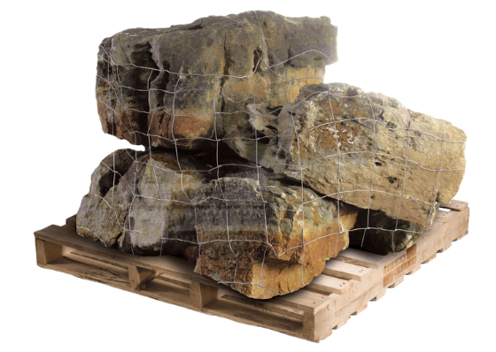 Weathered limestone natural stone boulders wrapped in mesh on a wooden pallet